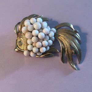 Elegant Gold and White Fish Brooch